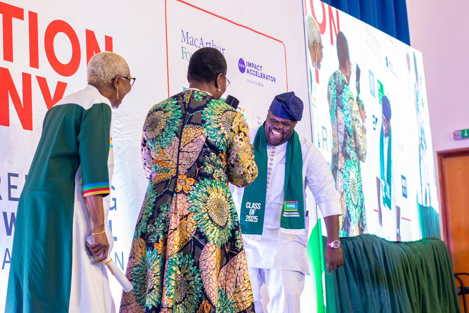 Dr Oby Ezekwesili congratulating a graduate at an SPPG ceremony